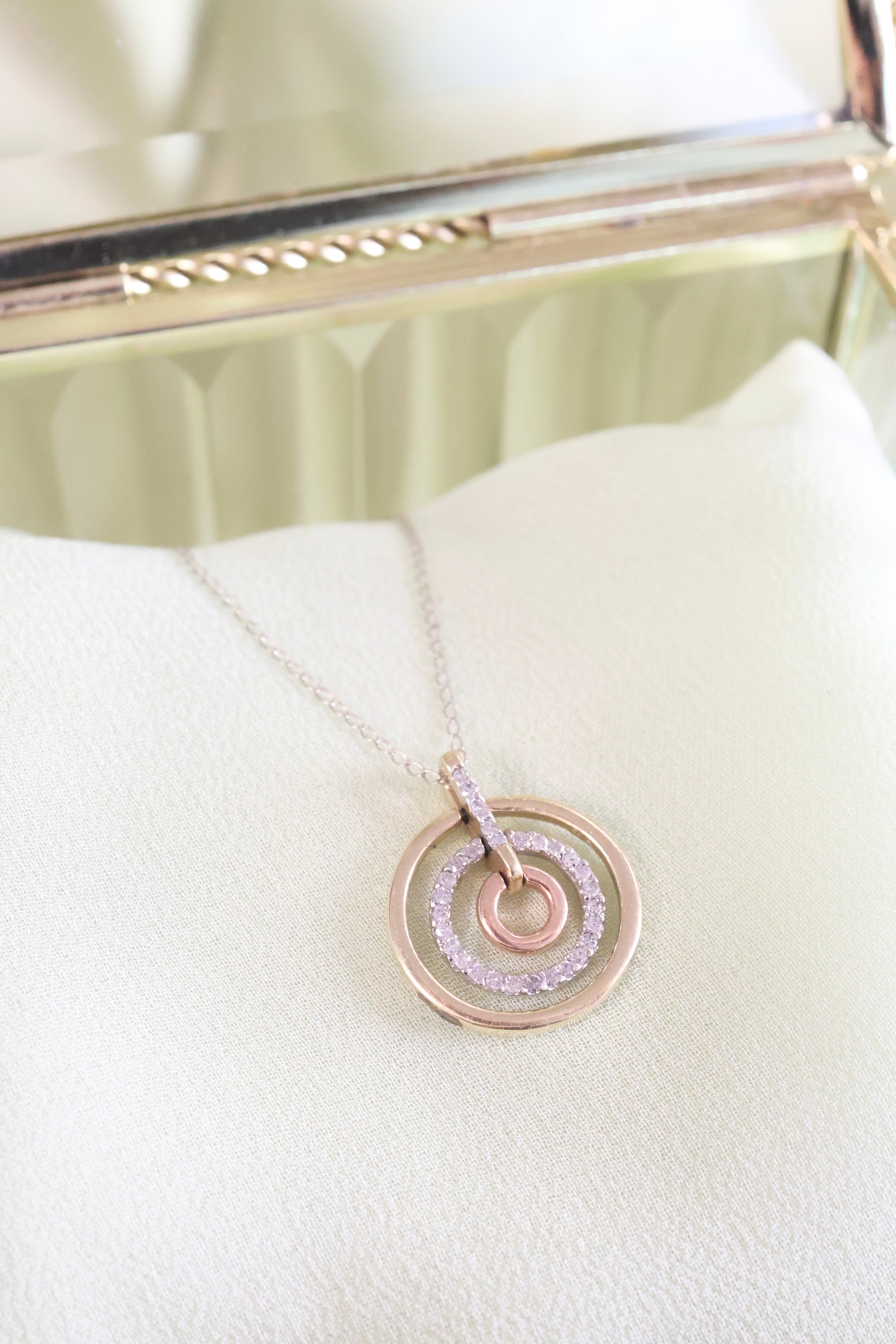 Three-Tone Solid Gold Circle Pendant with 1/3ct. t.w. Cut Diamonds